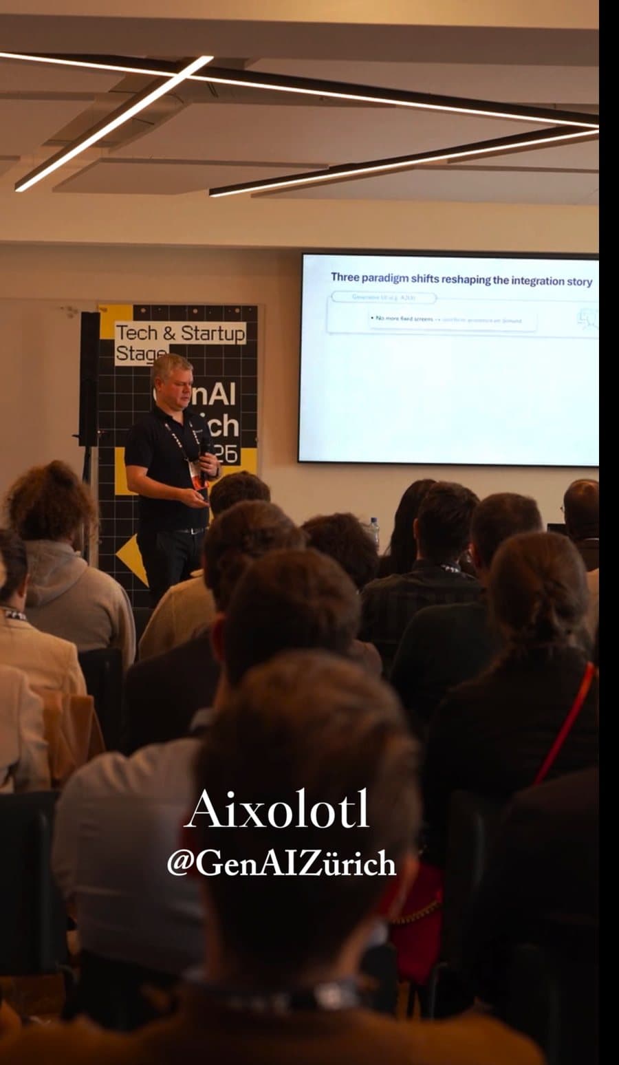 Event film still: speaker on stage at a business conference