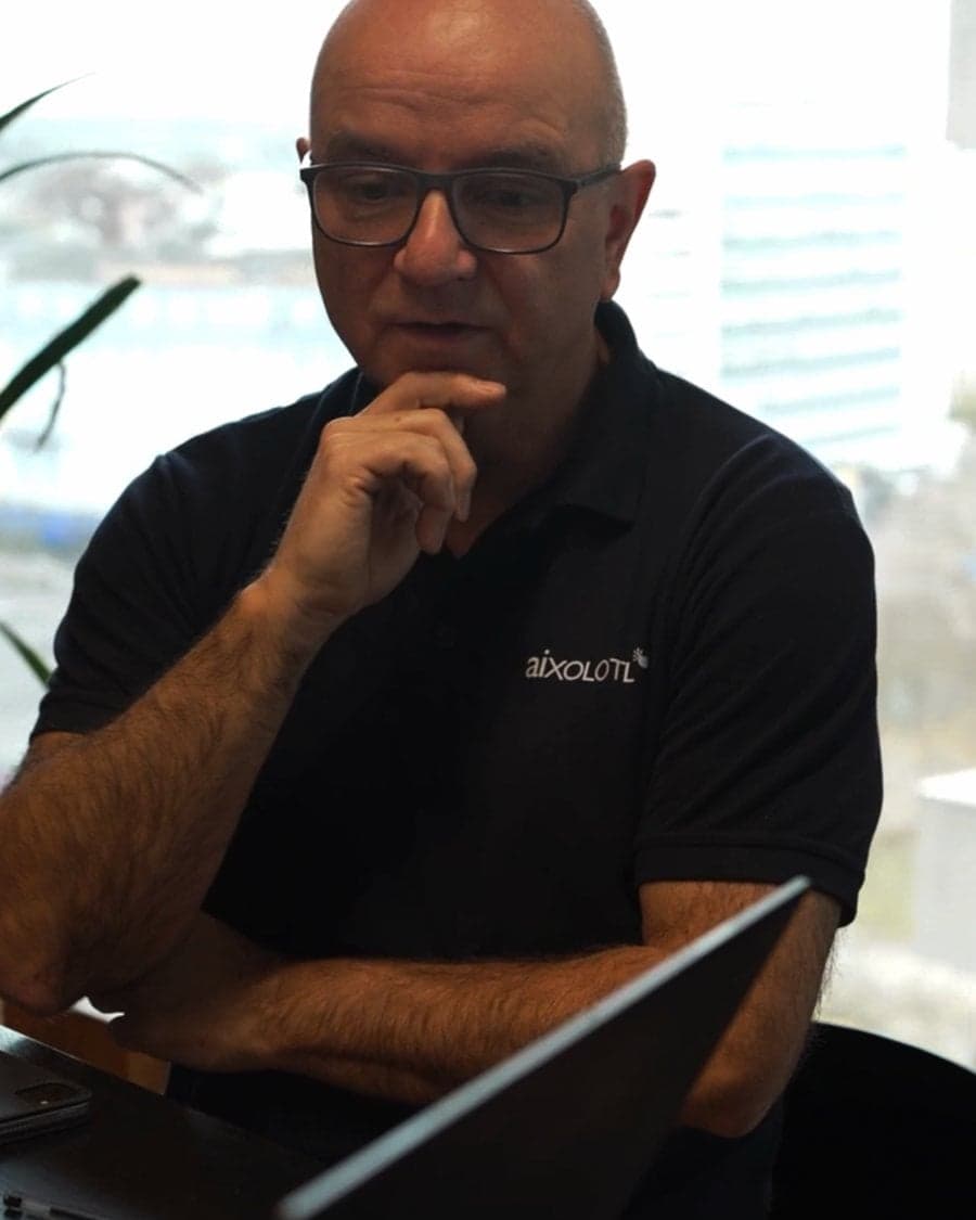 Team member listening at a meeting table